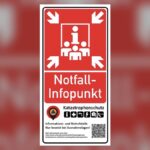 Rotes Hinweisschild eines Notfallinfopunkts in Schleswig-Holstein